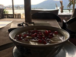Chamba porridge and mixed fruit, with a view. at Pourquoi Pas in Pokhara