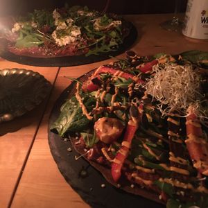 Bacon cheddar & primavera pizza at The Raw Kitchen Malmö in Malmo