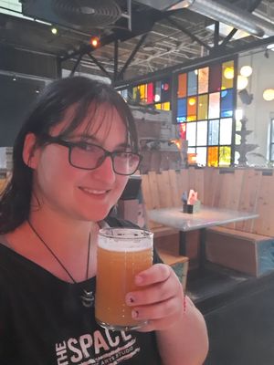 Having a beer at the bar at Bang Up To The Elephant in Denver