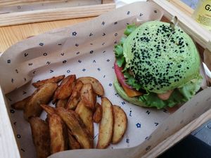 Jungle burger and potato wedges at Flower Burger in Bergamo