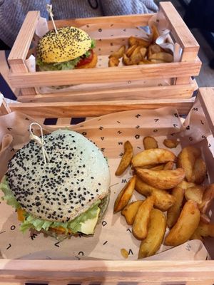 Zucchini burger and chickpea burger with baked potatoes   at Flower Burger in Bergamo