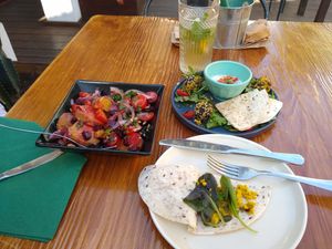 Sweet potatoes, tomatoes, beet, onion and basil salad, falafel special and white Port sangria! at Raiz in Sintra