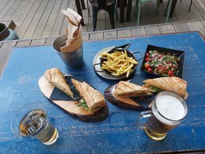 Sandwiches one with tofu one with tempeh, fries and the sweet potatoes salad at Raiz in Sintra