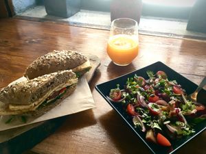 Tofu sandwich, sweet potatoes salad & fresh orange juice. at Raiz in Sintra