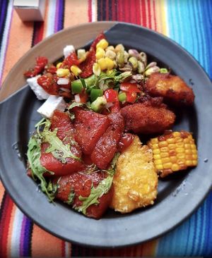 Vegan buffet: Watermelon steak, Buffalo cauliflower wings, crispy corncakes and vegan feta cheese.  at El Castillo in Valkenburg