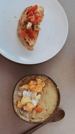 Tomato Bread (just 1 slice!!!) plus Green Smoothie Bowl at Kirana Cafe in Peniche