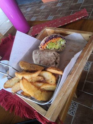 Vegan wrap with potato wedges at Aroma Coffee Bar in Cahuita