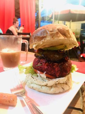 The new Red Passion Burger. Made with beets and DELICIOUS. Also great coffee! at Aroma Coffee Bar in Cahuita