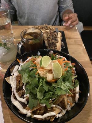 Vegan banh mi nachos & vegan cheesesteak with “pho cup" at 98 Center Moab in Moab