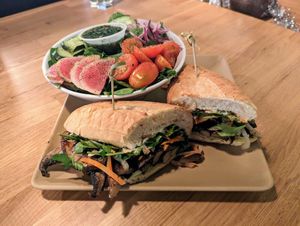 Mushroom bánh mì and side salad. at 98 Center Moab in Moab