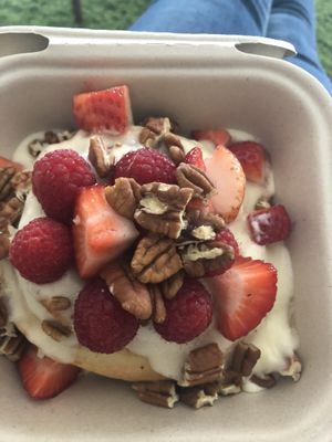 Custom: Amaretto frosting, with raspberries, strawberries, and pecans at Cinnaholic in San Jose