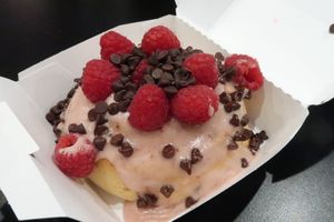 Cinnamon roll with raspberry sauce at Cinnaholic in San Jose