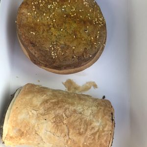 Curry pie and sausage roll  at Flour of Life Bakery in Helensvale