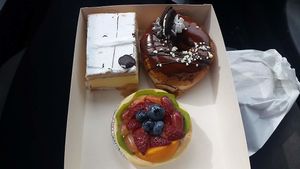 Custard slice, chocolate doughnut and fruit tartlet at Flour of Life Bakery in Helensvale