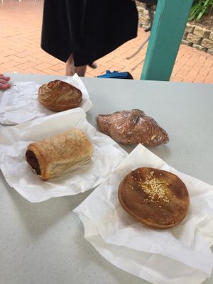 From back left - potato pie, cheese and ham croissant, curried chicken pie and sausage roll. Yum!  at Flour of Life Bakery in Helensvale