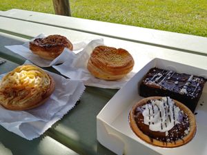 Cheesy Mornay, Chicken Curry and Mince & Mash pies + a Caramel Tart and Brownie to wash them down. at Flour of Life Bakery in Helensvale