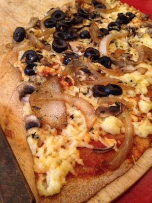 Pizza with vegan cheese and whole wheat dough  at Pizzeria Ecuador  in Valparaiso