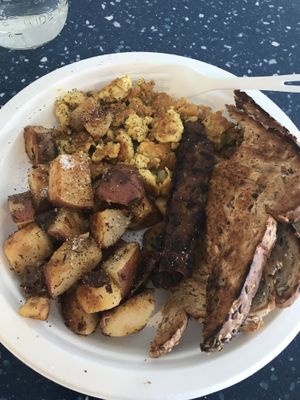 Yummy scrambled tofu with tempeh, potatoes and multi grain toast at Common Roots Cafe in Rye