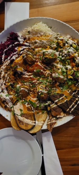 Platten for two : shawarma, oyster mushrooms, hummus, schakschuka, falafel, salads,  eggplant and potatoes at Hummus Küch' in Frankfurt