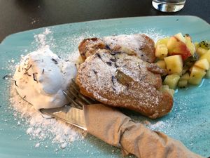 Dessert option fried banana with cream and fruit  at Vabiou's in Hamburg