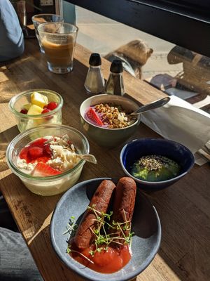 Fruit bowl, oatmeal, vegan sausages, avocado, soy yogurt at Cafe Hoegs in Copenhagen