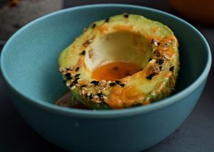 Avocado with piment dèspelette and sesame at Cafe Hoegs in Copenhagen
