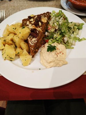 Vegetarian Kibeh with potatoes, salad and hummus at Fenícios in Lisbon