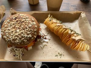 Oyster mushroom gyros burger and potato spiral. at Vegan Beat in Athens