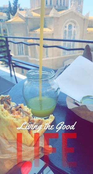 Chilling eating my food on balcony since all tables were full and the ones that weren’t didn’t have shade  at Vegan Beat in Athens