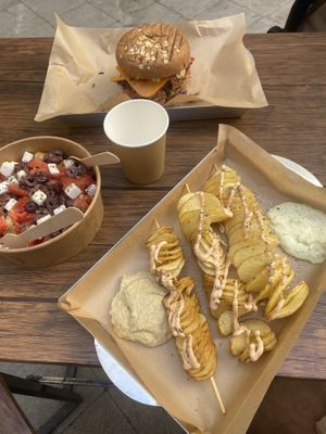 Gyros Burger, Greek Salad and Spiral Potatoes with hummus and tzatziki    at Vegan Beat in Athens