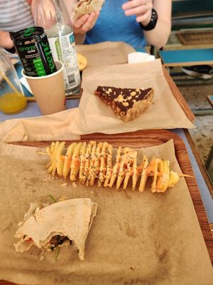Chips / equivalent and end of a wrap we devoured too quickly! at Vegan Beat in Athens
