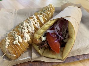 Mushroom-based vegan gyros with spiral potatoes as a side  at Vegan Beat in Athens