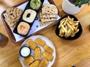 Trio of dips, fries and tofu nuggets  at Rhino Vegan Beat in Athens