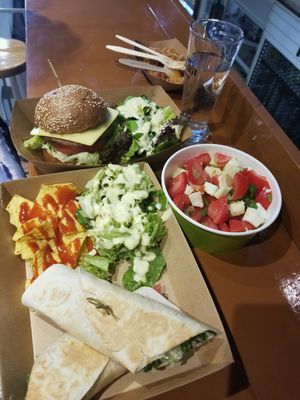 Vegan Beat tortilla wraps, Greek salad, burger.  at Vegan Beat in Athens