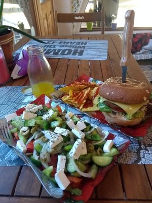 Greek salad, red bean & mushroom burger & juice with ginger at Vegan Beat in Athens