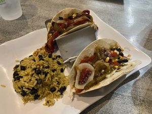 Server forgot my third taco. When he brought it out, it was slam packed with peppers and onions! 🤤  at Island Wing Company in Destin