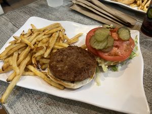 Classic burger with Beyond Meat and fries on gluten-free bun  at Island Wing Company in Destin
