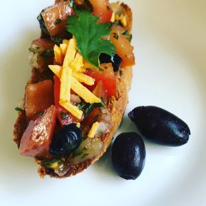 Bruschetta with Kalamata Olives on Homemade Multi-Grain Baguette. at Vegan Delights by Lisa-Ann in Whitby
