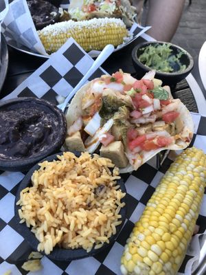 Crispy tofu and kimchi tacos with vegetarian refried black beans, rice, and corn at The Taco Joint in Hollywood