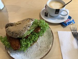 Dabbing Buddha bagel with vegan cappuccino at Olivia's Maastricht in Maastricht