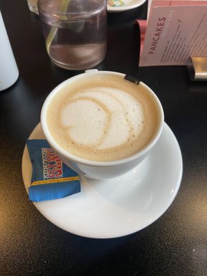 Cappuccino with oatmilk. Very thoughtful they placed a vegan Tony’s on the side!   at Olivia's Maastricht in Maastricht