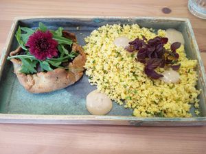 Mushroom and caramelized onions tart with couscous and tahini sauce at Cozinha de Alecrim in Lisbon