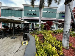 Outdoor seating with umbrellas  at Moku Roots in Kula