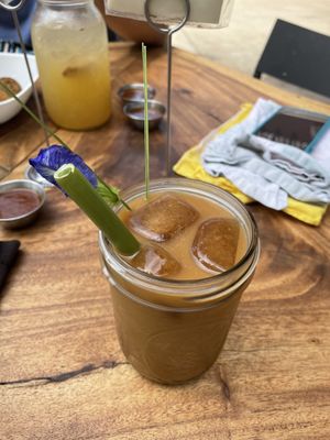 Mac-milk latte with papaya straw  at Moku Roots in Kula