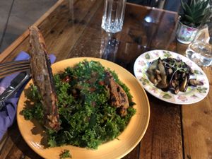 Kale Salad w/ Taro Burger & grilled mushrooms at Moku Roots in Kula