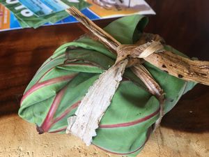 Vegan sushi roll wrapped to go in Taro leaf at Moku Roots in Kula