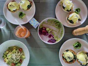 Benedict's eggs, pistachio pesto spaghetti and 
smoothies at The Avocado Factory in Canggu