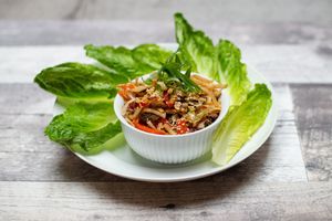 Lettuce Wrap, w/ Flame Roasted Green Vegetables, Mushrooms, Onions, Bell Peppers, Romaine, Sesame Seeds, House Made Tongkatsu Sauce, Rice Noodles, Toasted Cashews at 97 Street Pub in Kelowna