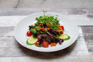 House Salad, Heritage Mixed Greens, Carrots, Grape Tomatoes, Sun Dried Fruits, Maple Balsamic Vinaigrette at 97 Street Pub in Kelowna