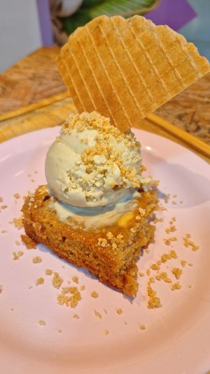 Seasonal flavour. Corn ice cream with peanut blondie. Superb. at Jazzlato in Recife